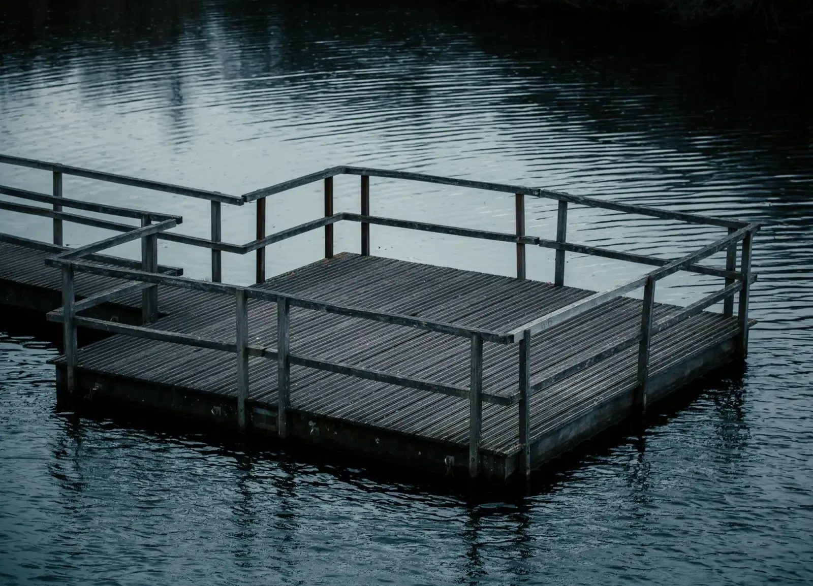 Weathered wood boat dock in need of repair on a Lake of the Ozarks cove in Osage Beach, Missouri